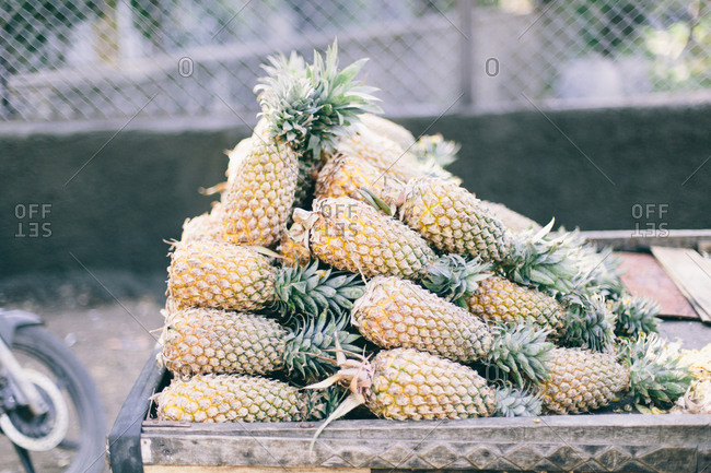 Pineapple on a wood cart