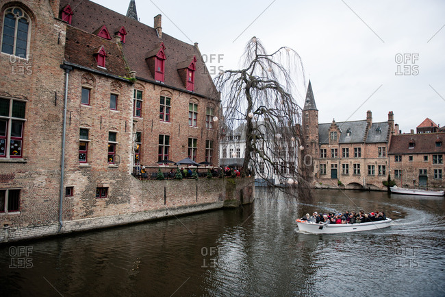 Bruges, Belgium - December 21, 2015: Bruges Canal boat tour in Bruges, Belgium
