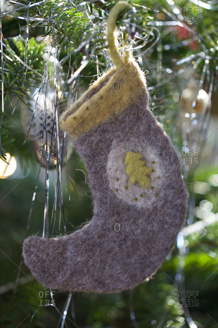 Stocking ornament hanging on Christmas tree