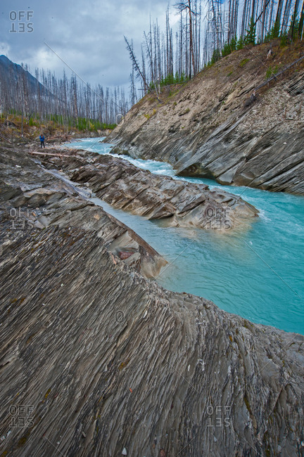 The Vermillion River flows between eroded rocks
