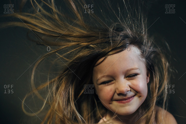 Smiling girl with windblown hair