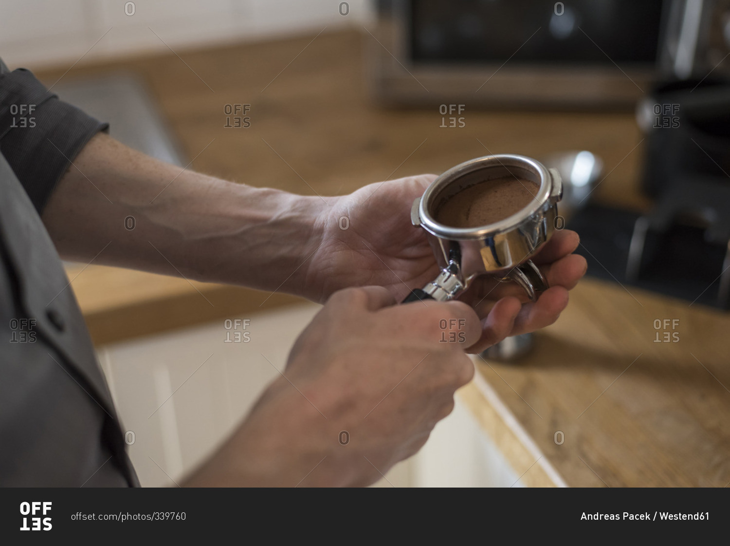 Preparing a cappuccino, coffee filter, pressed coffee powder in portafilter