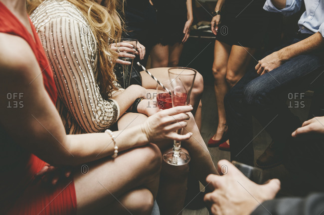 Friends hanging around and drinking at a party