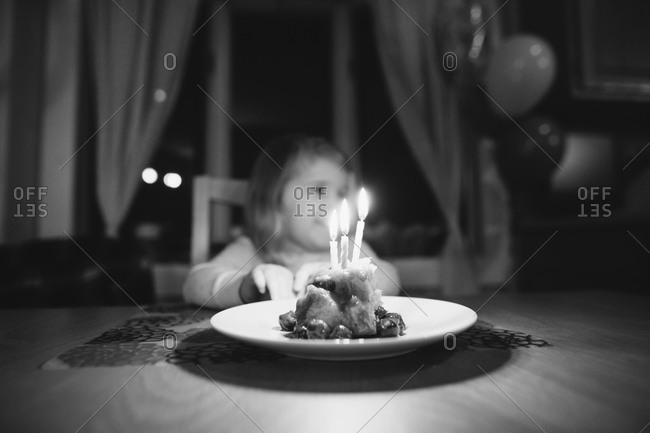 Girl sitting at a table preparing to celebrate her birthday