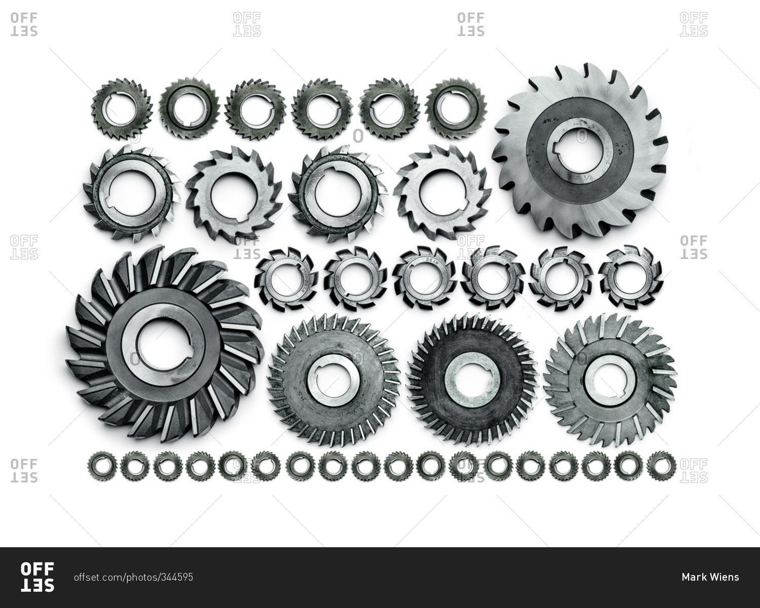 Various size circular saw blades in a line stock photo OFFSET