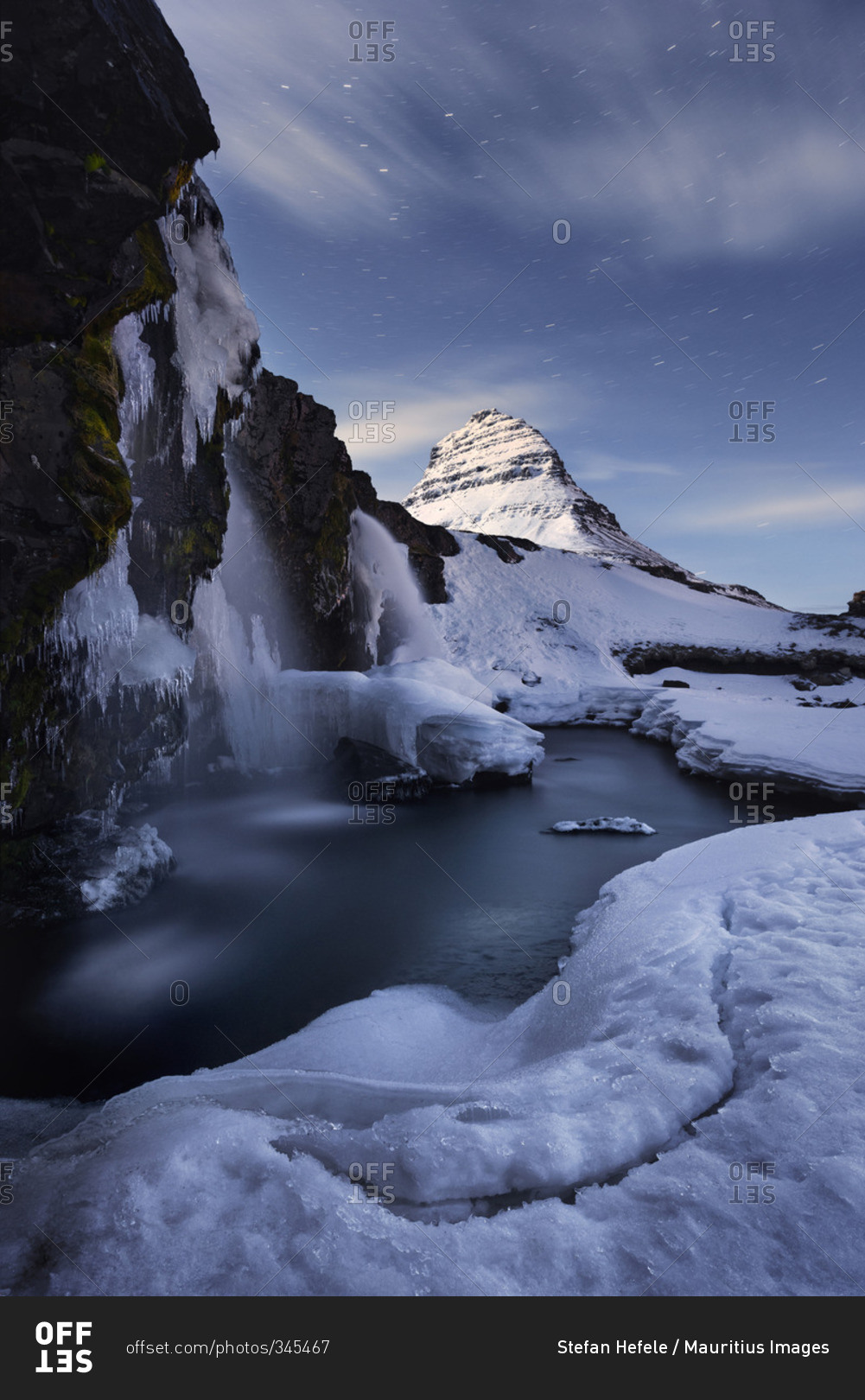 Kirkjufell (Icelandic: Church mountain) at night stock photo - OFFSET