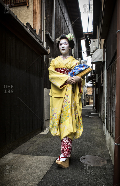 Japan - June 17, 2014: Geisha walking along the street