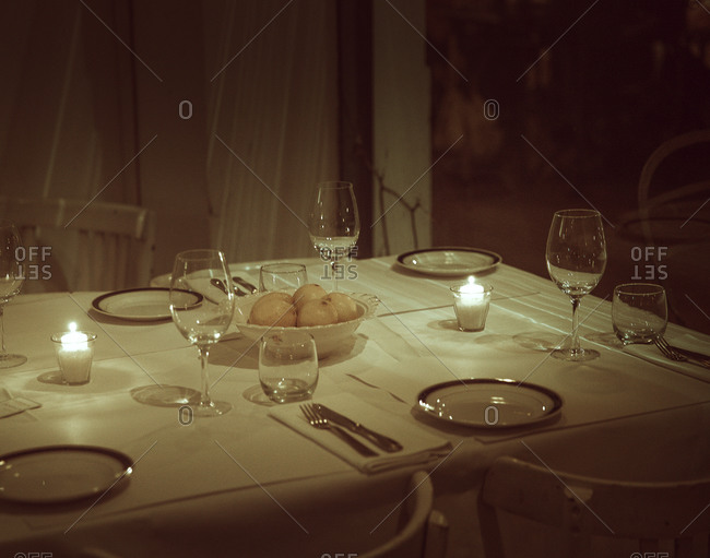 Dining table lit by candles