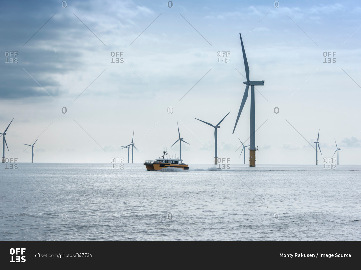 View of offshore windfarm and service boat