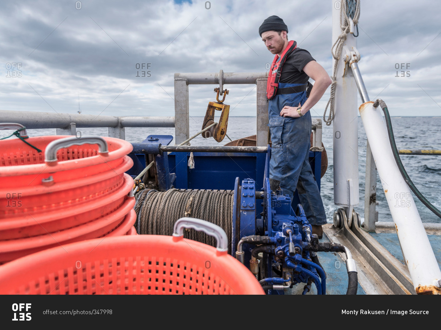 Fisherman With Winch On Trawler Research Ship Stock Photo Offset