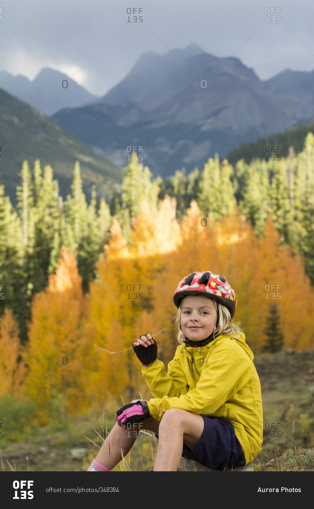 A young girl mountain biking in the San Juan National Forest, Silverton, Colorado.