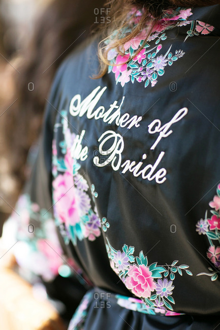Close up of mother of the bride embroidered robe