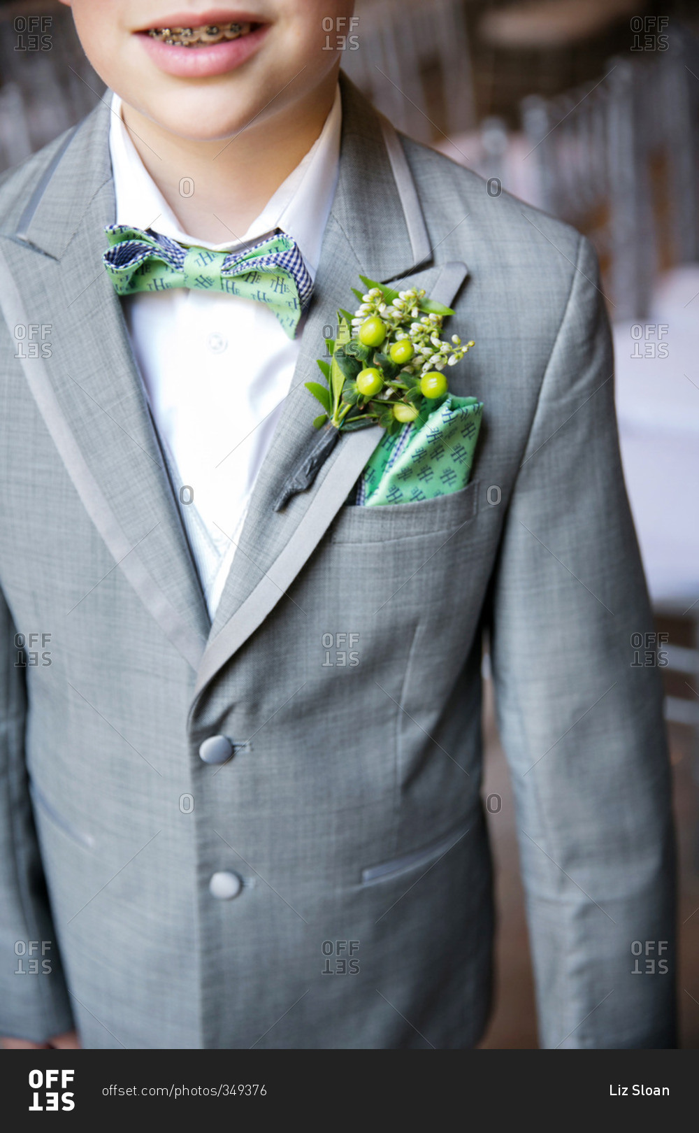 Close-up of a ring bearer's boutonniere and pocket square