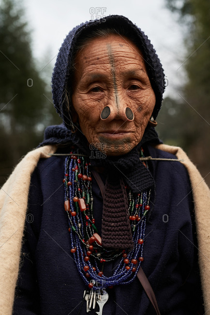 Arunachal pradesh, India - January 30, 2016: Portrait of an Apatani woman with traditional bamboo discs in her nose