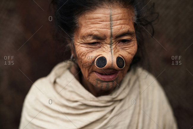 Arunachal pradesh, India - January 30, 2016: Portrait of an Apatani woman with traditional bamboo discs in her nose