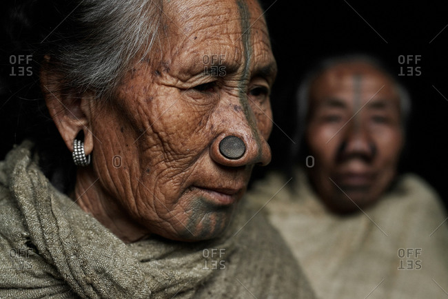 Arunachal pradesh, India - February 1, 2016: Portrait of an Apatani woman with traditional bamboo discs in her nose