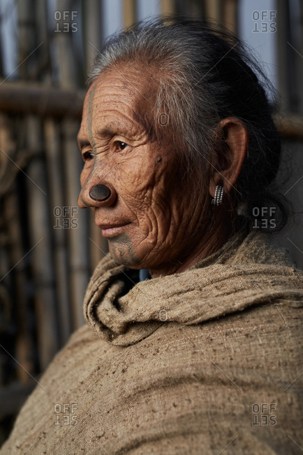 Arunachal pradesh, India - February 1, 2016: Portrait of an Apatani woman with traditional bamboo discs in her nose