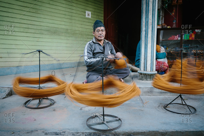 yarn spinning wheel stock photos - OFFSET