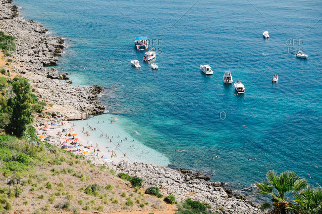 Elevated view of people and boats at beach in Palermo