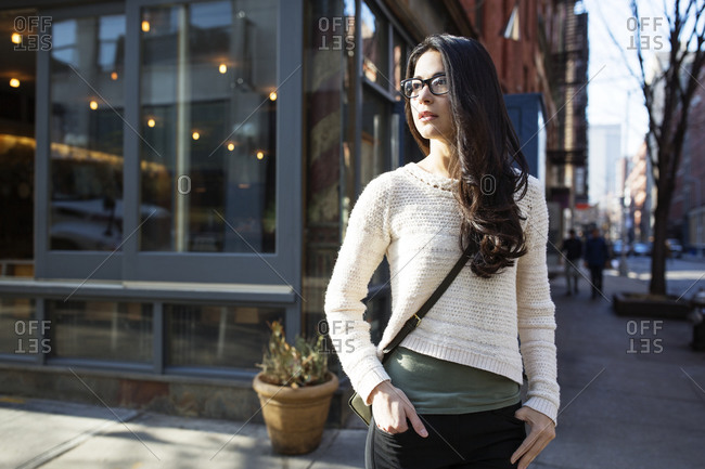 Young Woman Standing On A City Street Corner Stock Photo Offset