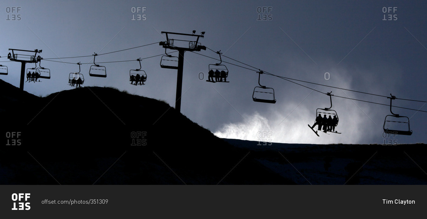 Panoramic view of the ski lifts and a snow machine blowing snow at Coronet Peak, Queenstown,  South Island, New Zealand