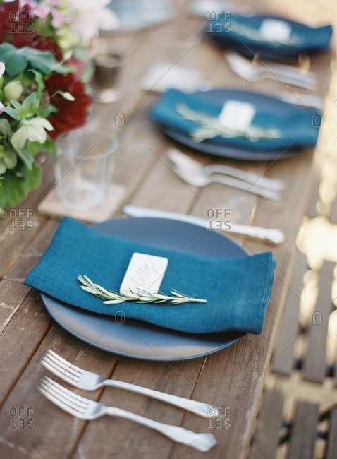 Blue table setting on a wooden table