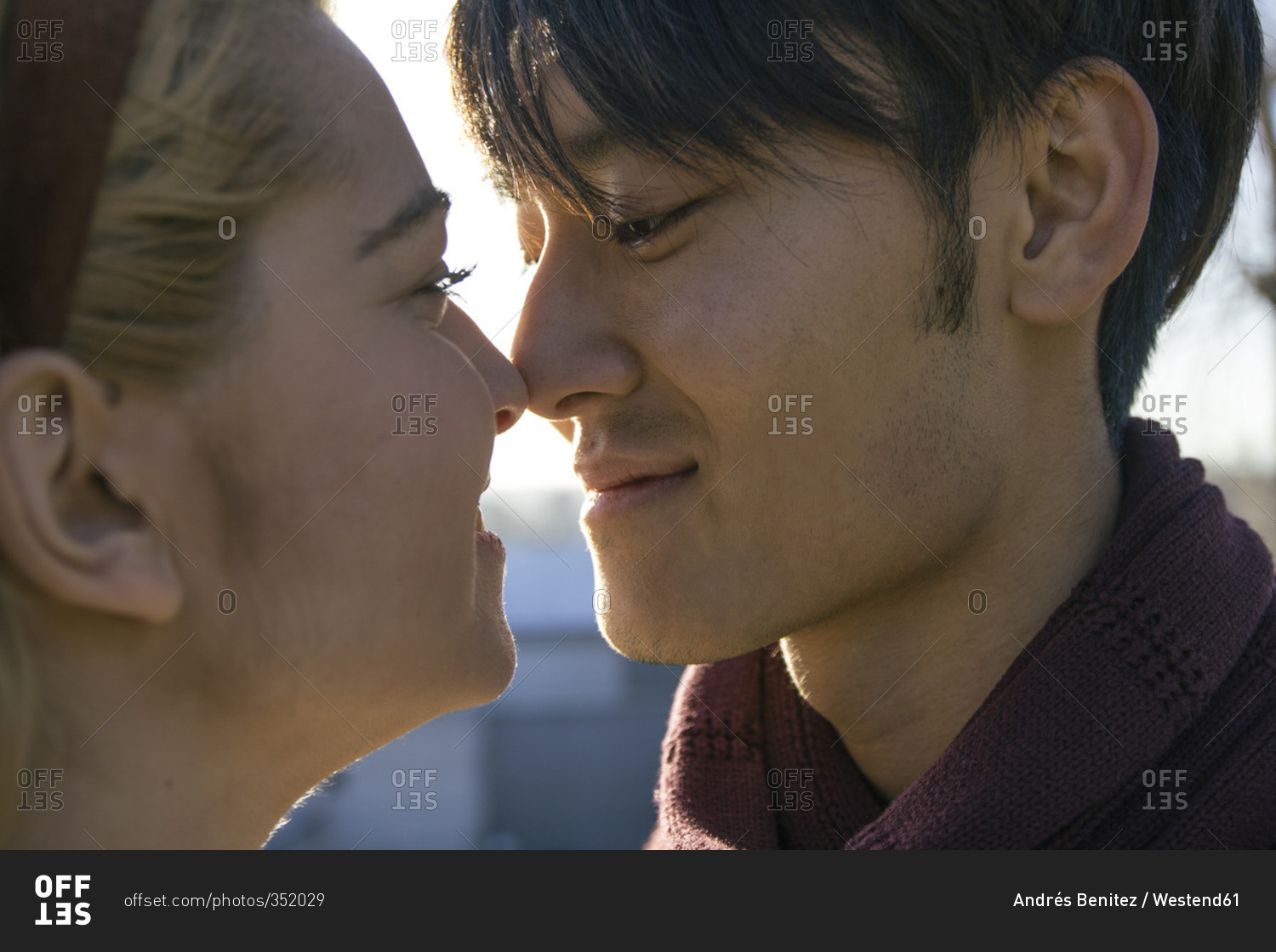 Young man touching nose of his girlfriend with his nose