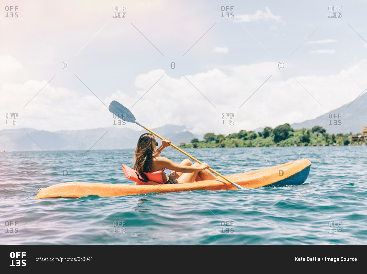Young woman kayaking on  Lake Atitlan, Guatemala