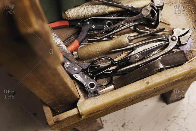 Close up of tool box and hand tools in shoe makers workshop