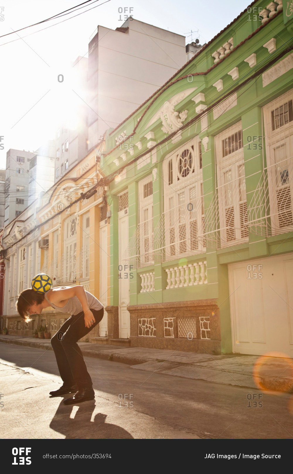 Student celebrating with soccer skills in the street, Rio de Janeiro, Brazil