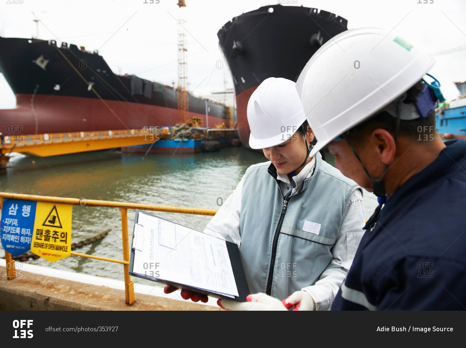 Workers having discussion at shipping port, GoSeong-gun, South Korea