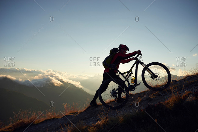 pushing a bike