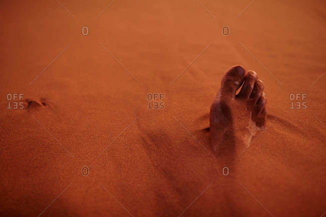 Feet covered in sand - Offset