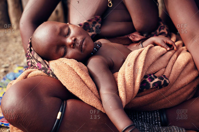 Namibia - March 17, 2016: Namibian child in mom's lap