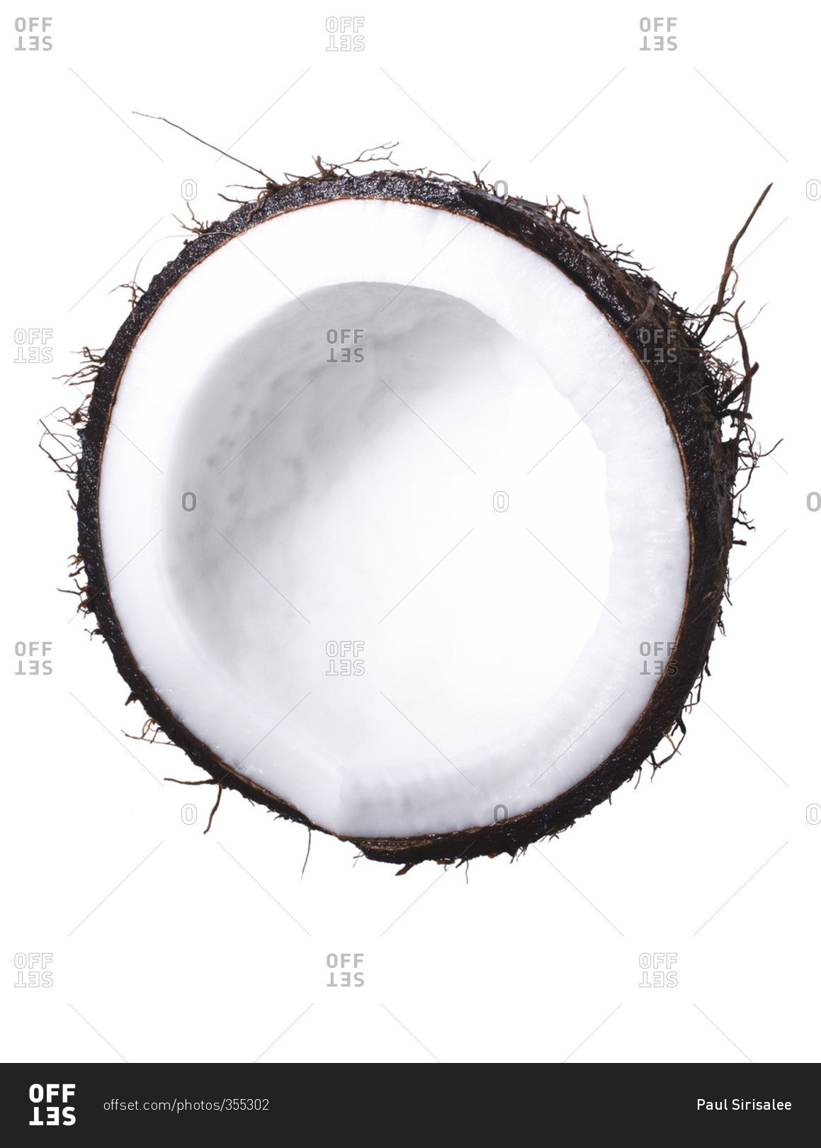 Coconut half on a white seamless background stock photo - OFFSET