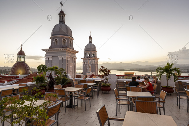 Santiago de Cuba, Cuba - February 3, 2016: Rooftop deck with a view of Nuestra Senora de la Asuncion cathedral at Parque Cespedes, Santiago de Cuba, Cuba