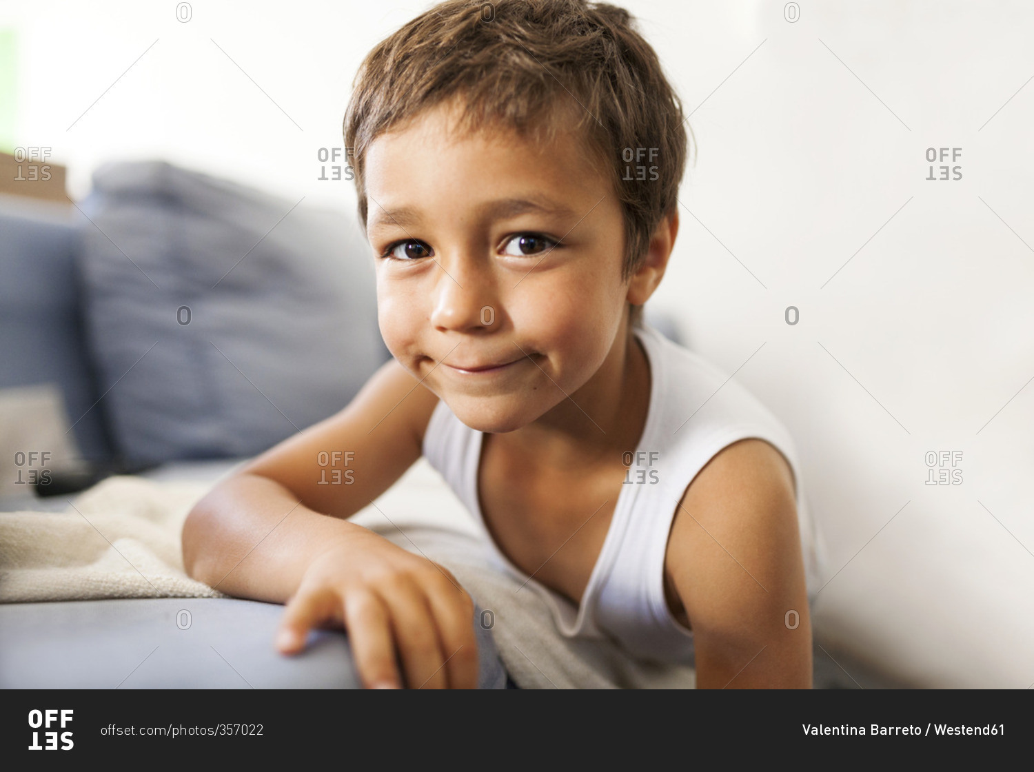 Portrait of smiling little boy wearing tank top stock photo OFFSET