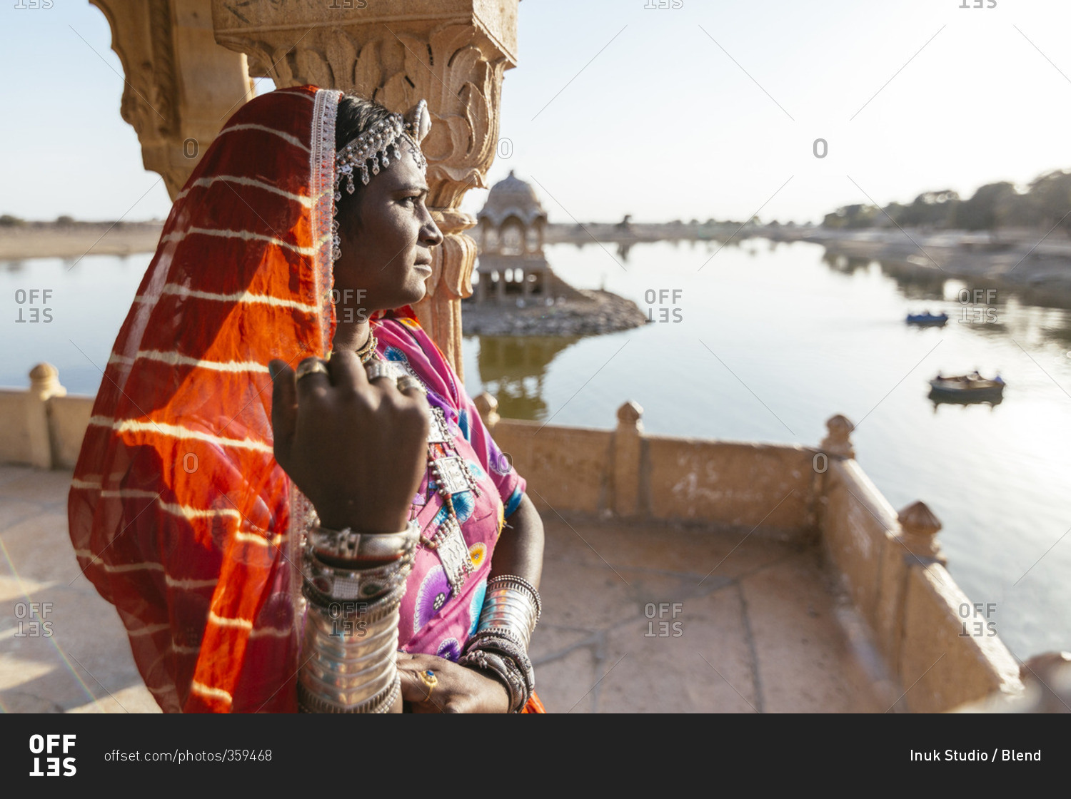 Indian woman admiring view from monument, Jaisalmer, Rajasthan, India