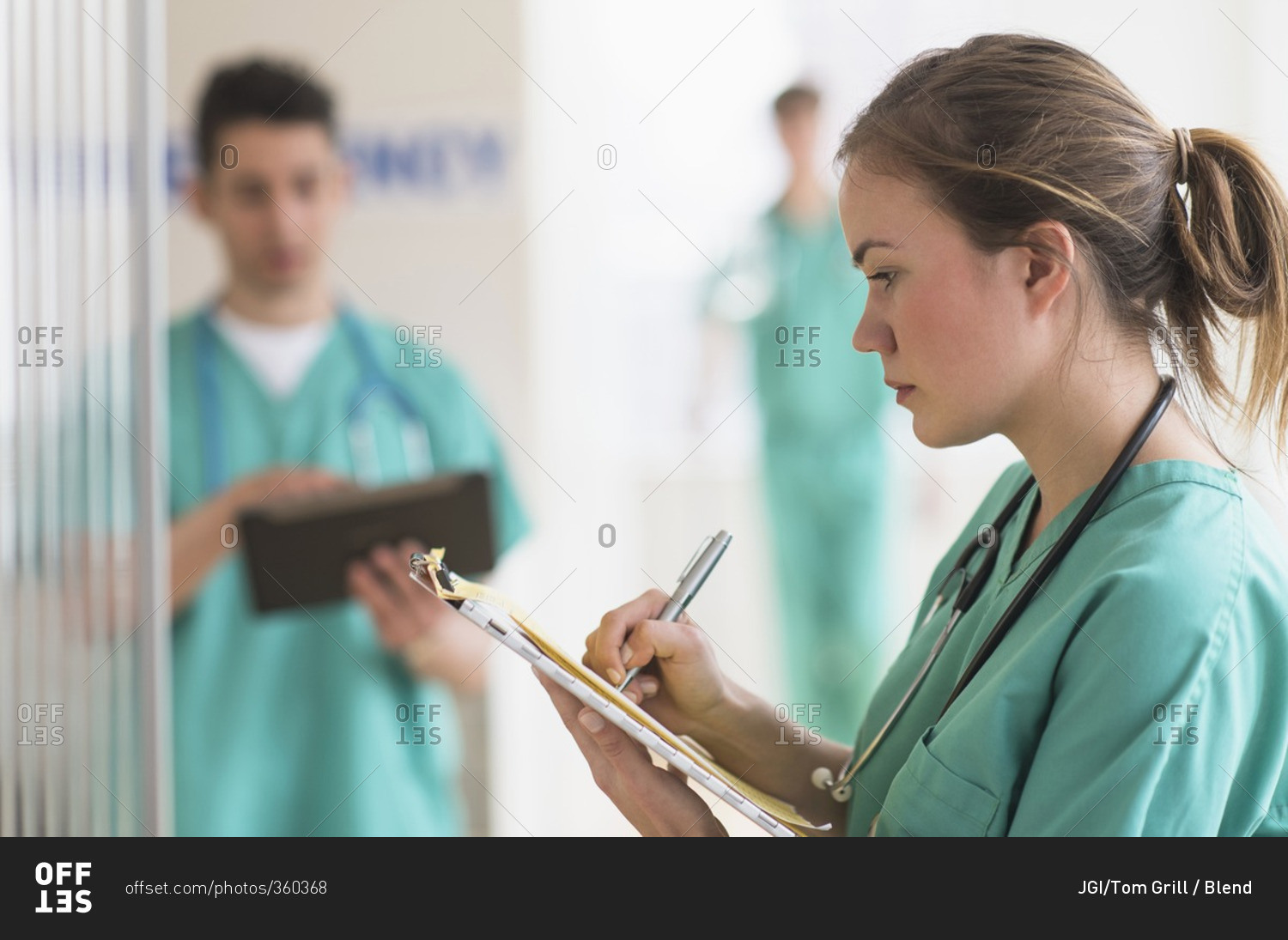 Doctor writing notes in hospital emergency room