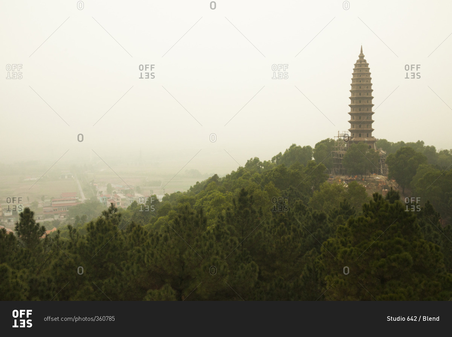 Buddhist temple tower on hilltop in remote landscape