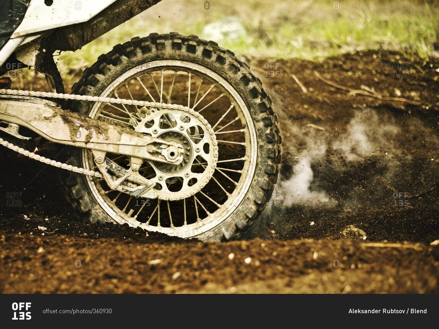 Dirt bike tire smoking in dirt