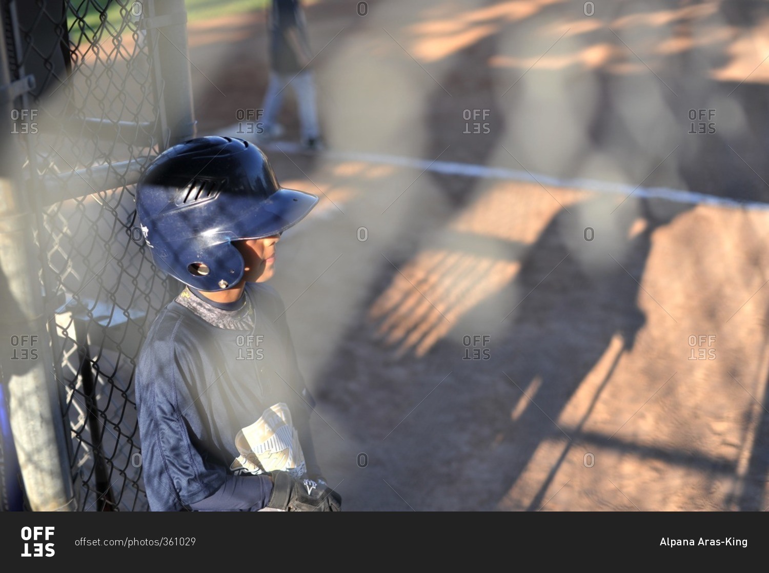 Boy in baseball helmet at field