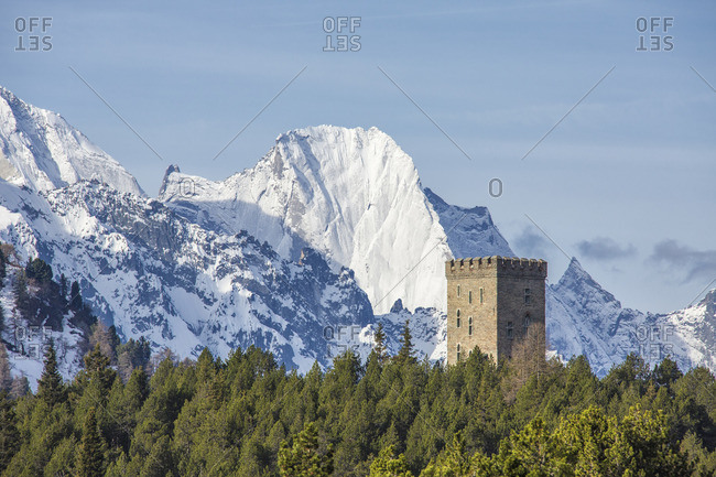 The Belvedere Tower frames the snowy peaks and Peak Badile on a spring day Maloja Pass Canton of Graubunden Switzerland Europe