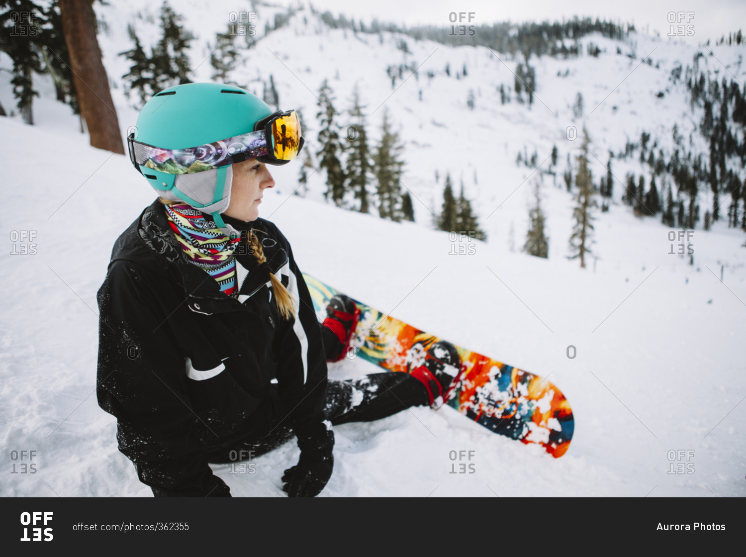 A woman snowboarding in Lake Tahoe
