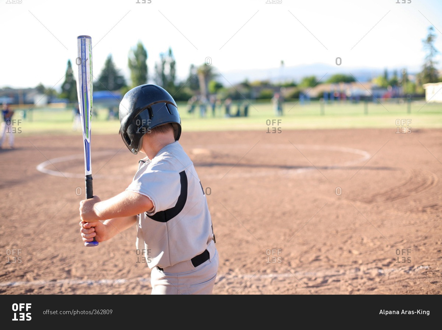 Boy up to bat at a baseball game