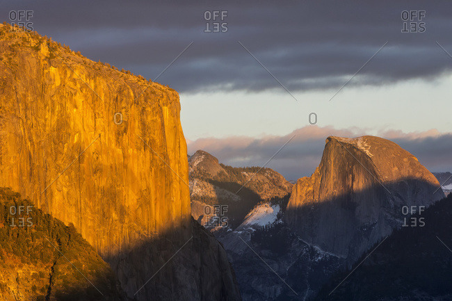El Capitan and Half Dome in late afternoon winter light, as seen from Turtleback Dome in Yosemite National Park; California, United States of America