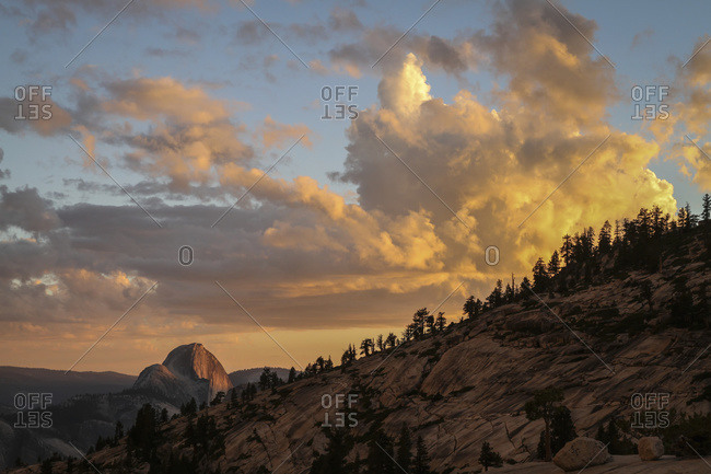 Half Dome at sunset during the Meadow Fire, as seen from near Olmsted Point along the Tioga Pass Road in Yosemite National Park; California, United States of America
