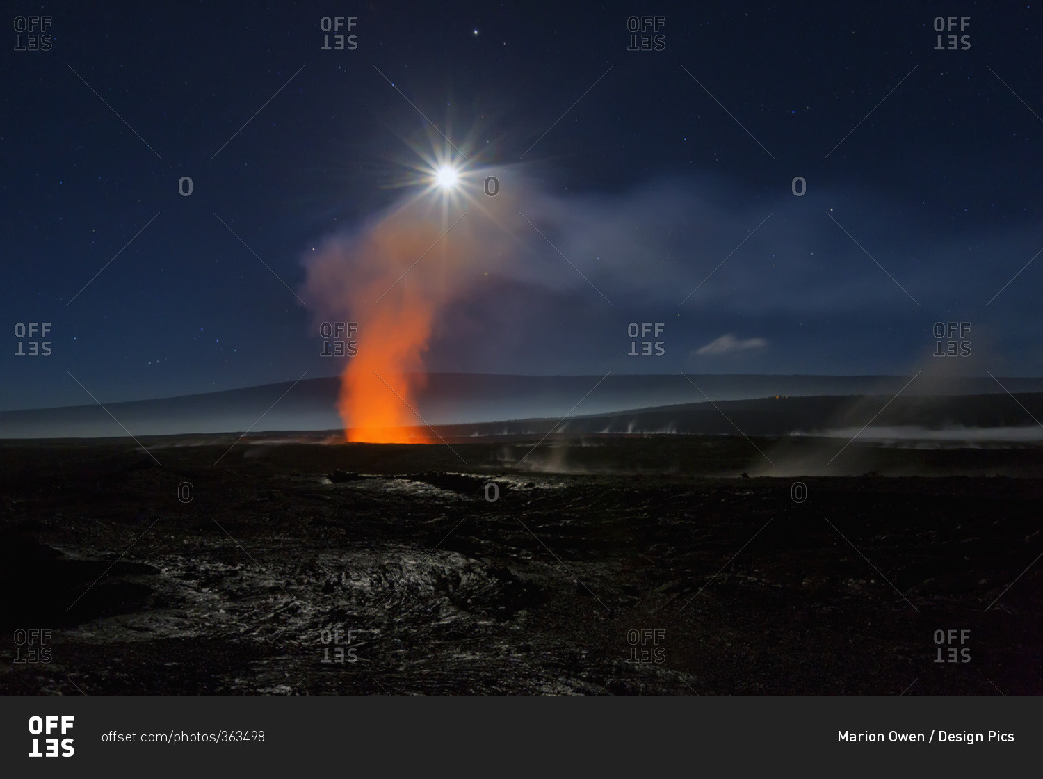 Full moon over Halemaumau Crater within the much larger summit caldera of Kilauea in Hawaii Volcanoes National Park, steaming vents in foreground, Mauna Loa mountain in background; Island of Hawaii, Hawaii, United States of America