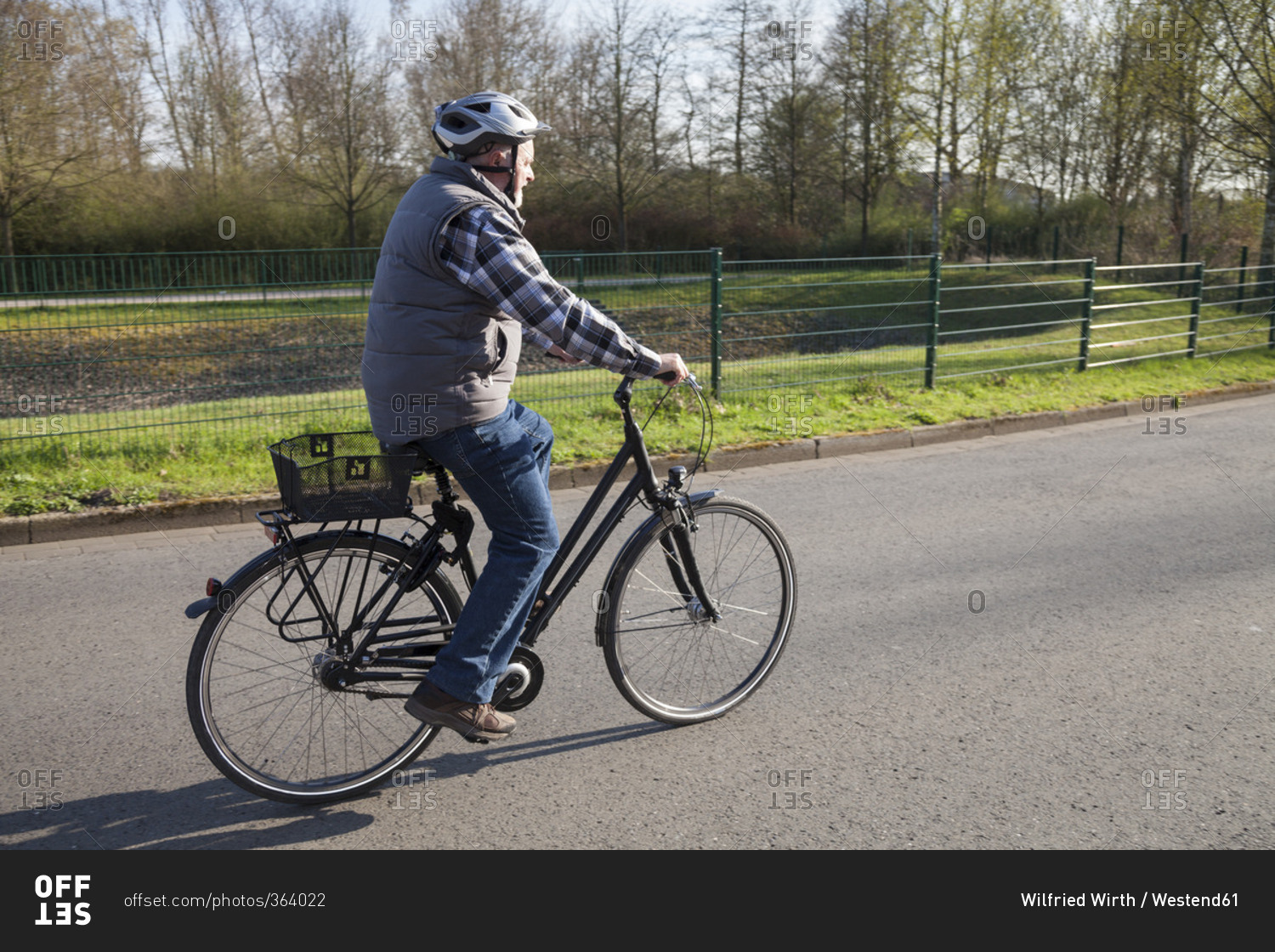 Senior man riding bicycle