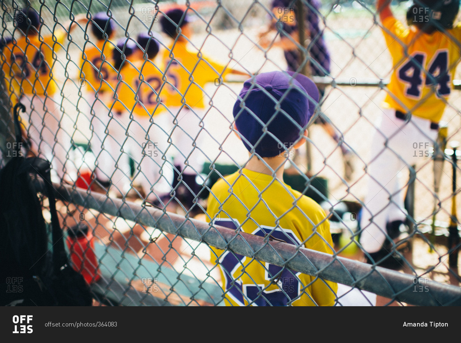 Boys on a baseball team in a dugout